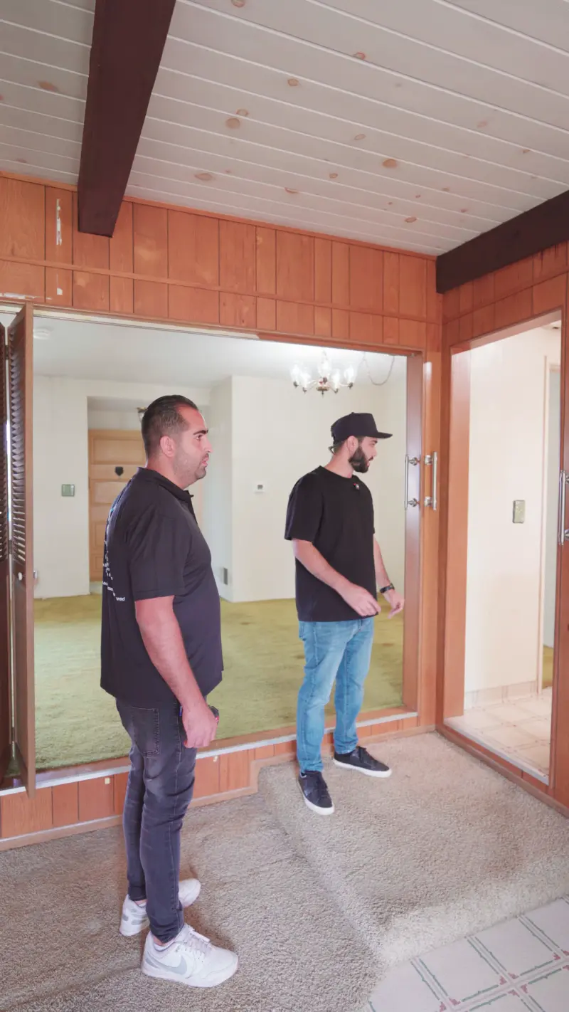 Sal and his contractor in the paneled family room